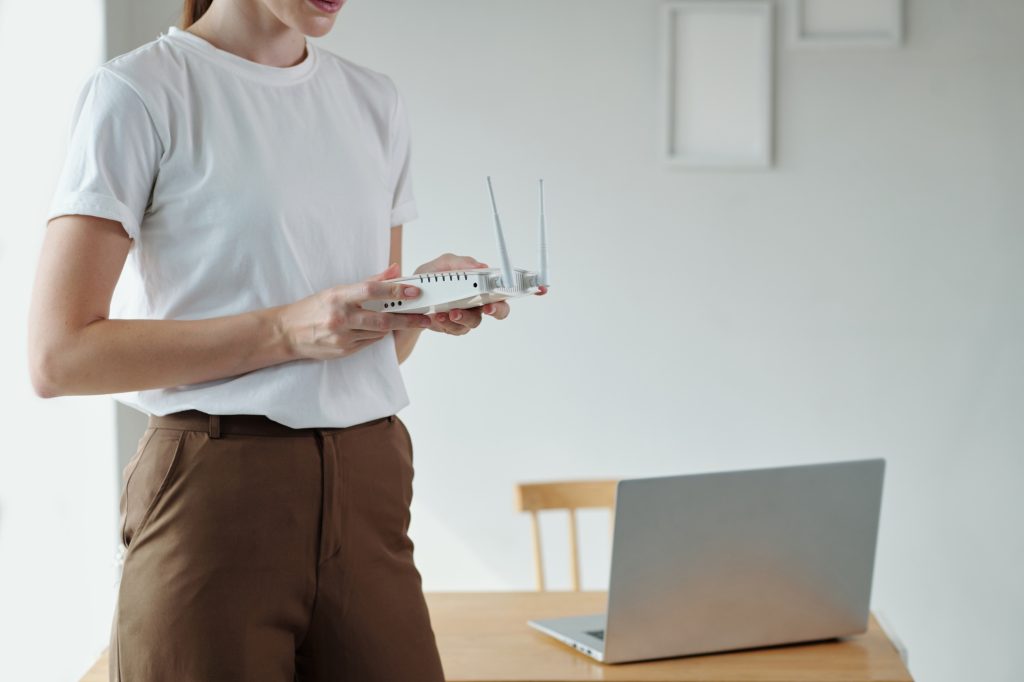 Woman Setting Wi-fi Router